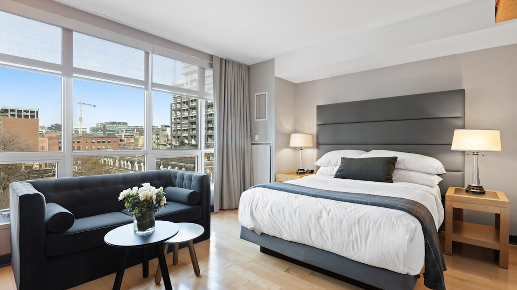 A suite at White Heath with a tall sash window and morning light