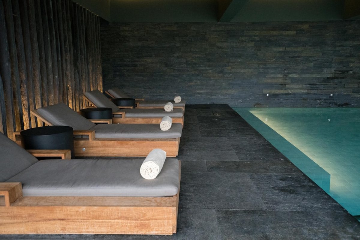 A relaxation lounger and robes at the spa