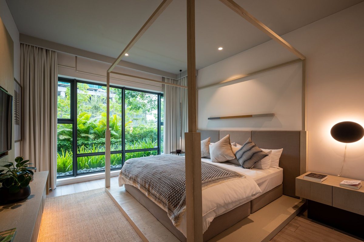 The bedroom of a Heriot Suite with a freestanding bath